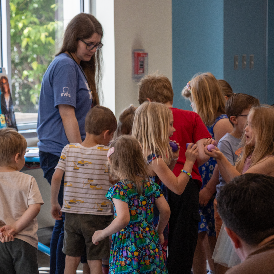 EVPL staff member helping a student
