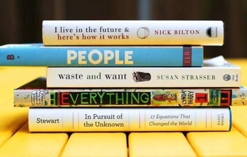 Book spines say: I live in the future & here's how it works, people, waste and want, everything, in pursuit of the unknown