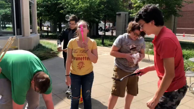 Teens take a break from schoolwork to enjoy some bubbles on the patio at EVPL Central.