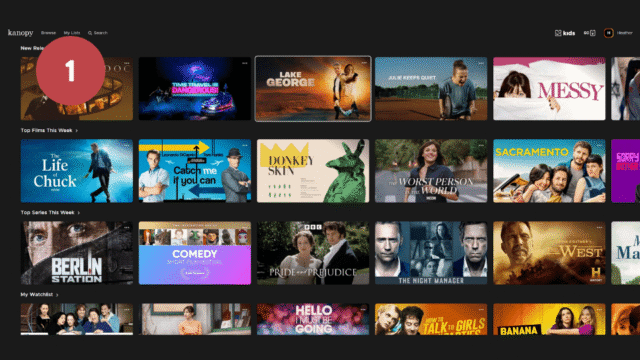 Screenshot of Kanopy interface displaying a grid of movie and TV show thumbnails organized into categories like "New Releases," "Too Films This Week," "Too Series This Week," and "My Watchlist." Thumbnails feature diverse genres with colorful titles and images, including labels such as "Comedy Short Film Festival" and notable titles like "Lake George" and "Sacramento."